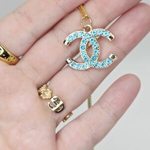 AUTHENTIC CHANEL Gold and Blue Crystal Pendant Necklace